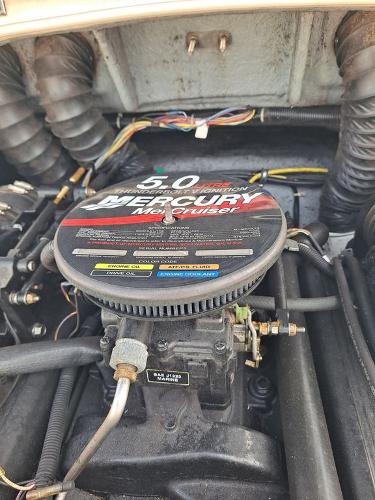 Slide: The Image of 2003 Bayliner 205 Olympic Edition engine, featuring a 5.0 Mercury MerCruiser. - 13