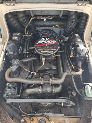 Slide: The Image of 2003 Bayliner 205 Olympic Edition boat engine, featuring a 5.0 Mercury motor. - 8