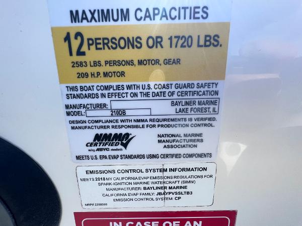 Slide: The Image of 2018 Bayliner 210 Deck Boat capacity label: 12 persons or 1720 lbs, 209 HP motor. - 22