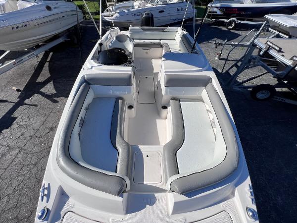 Slide: The Image of 2018 Bayliner 210 Deck Boat with spacious seating and modern design. - 24