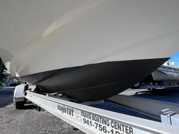 Slide: The Image of 2018 Bayliner 210 Deck Boat on a trailer at Travis Boating Center. - 8