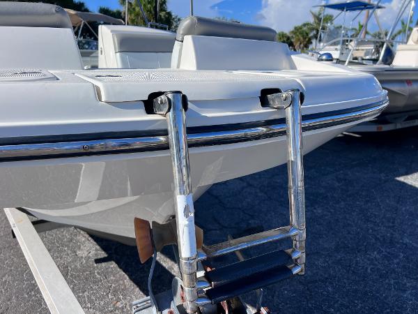 Slide: The Image of 2018 Bayliner 210 Deck Boat with a stainless steel swim ladder. - 9