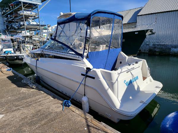 Slide: The Image of 1995 Bayliner 2355 Ciera Sunbridge docked at marina. - 0