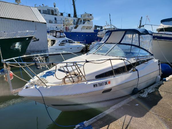 Slide: The Image of 1995 Bayliner 2355 Ciera Sunbridge docked at a marina. - 1