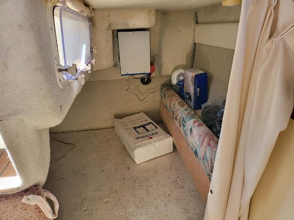 Slide: The Image of Interior cabin of a 1995 Bayliner 2355 Ciera Sunbridge boat with storage and seating. - 11
