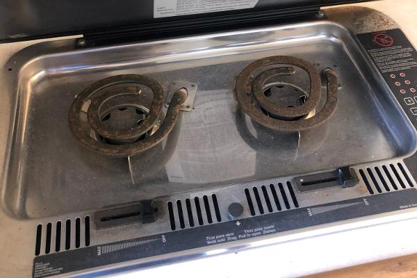 Slide: The Image of 1998 Bayliner 2452 Ciera Express boat stove with dual electric burners. - 14
