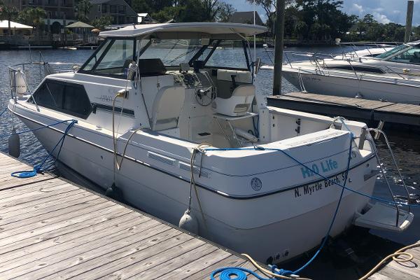 Slide: The Image of 1998 Bayliner 2452 Ciera Express docked at marina, North Myrtle Beach, SC. - 5