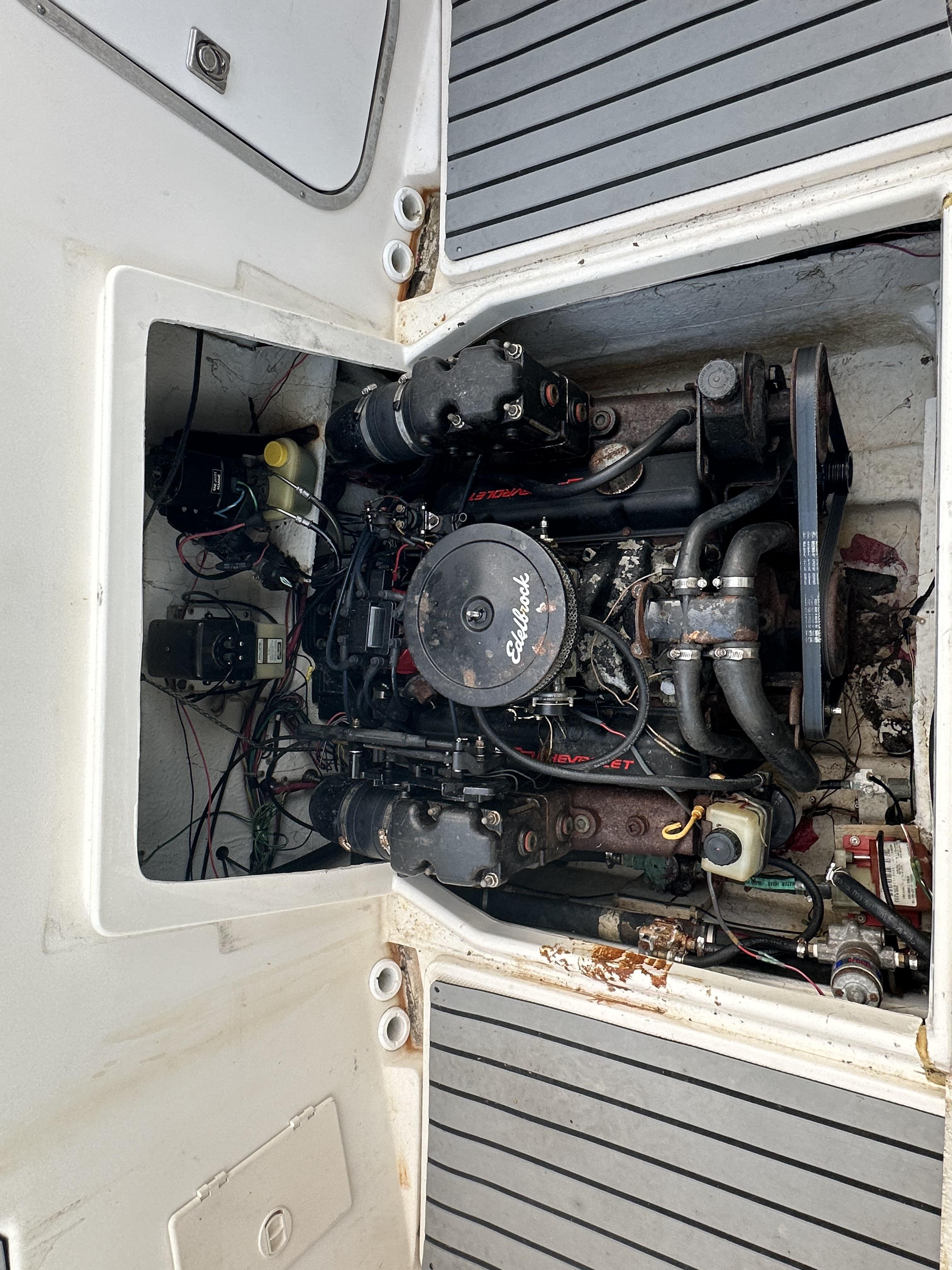 Slide: The Image of Engine compartment of a 1998 Bayliner 2452 Ciera Express boat, showing detailed mechanical components. - 7