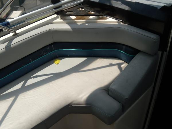 Slide: The Image of 1988 Bayliner 2655 Ciera Sunbridge interior seating area with gray cushions. - 6