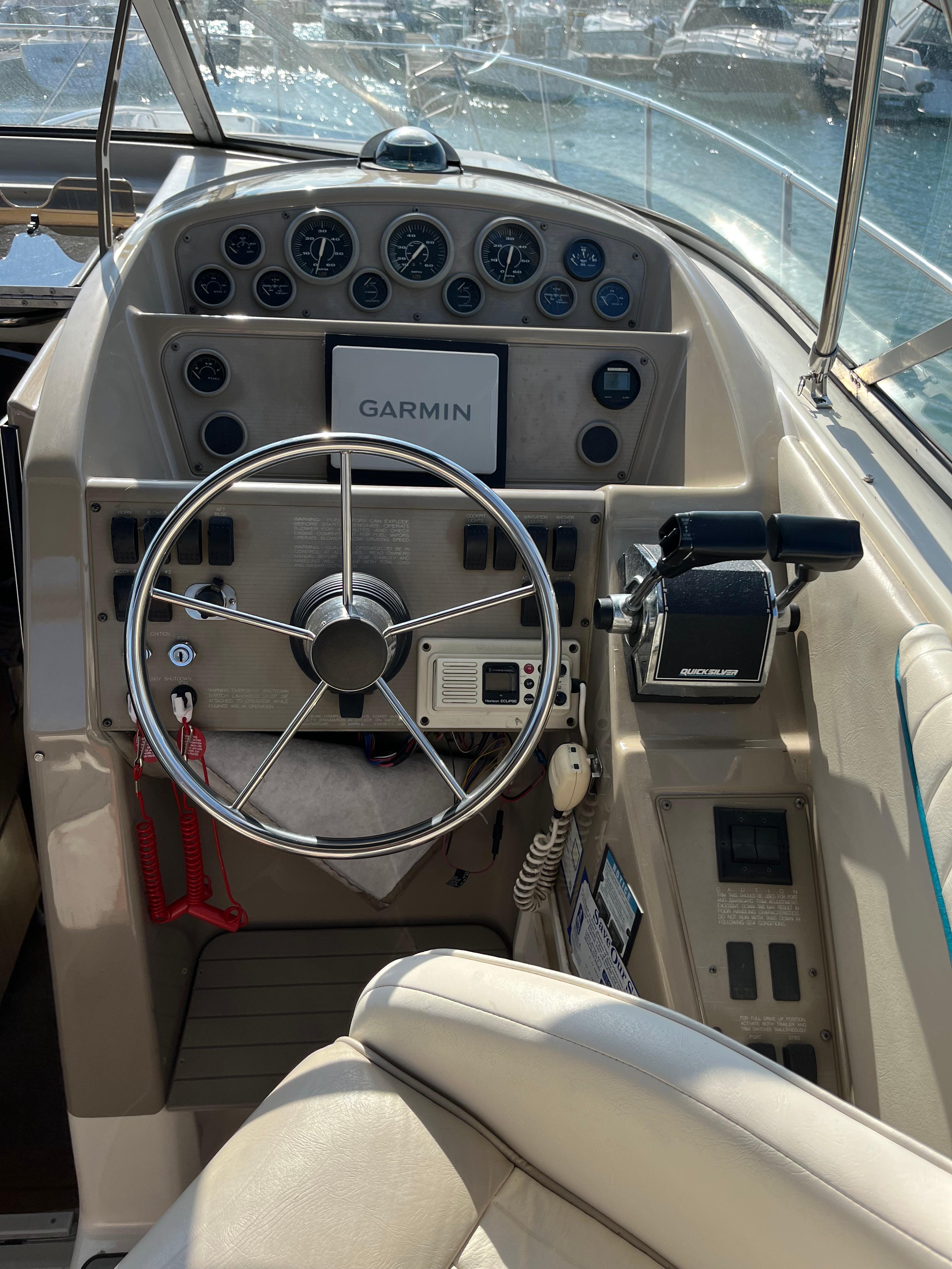 Slide: The Image of 1996 Bayliner 32 Avante helm with Garmin navigation system and control panel. - 11