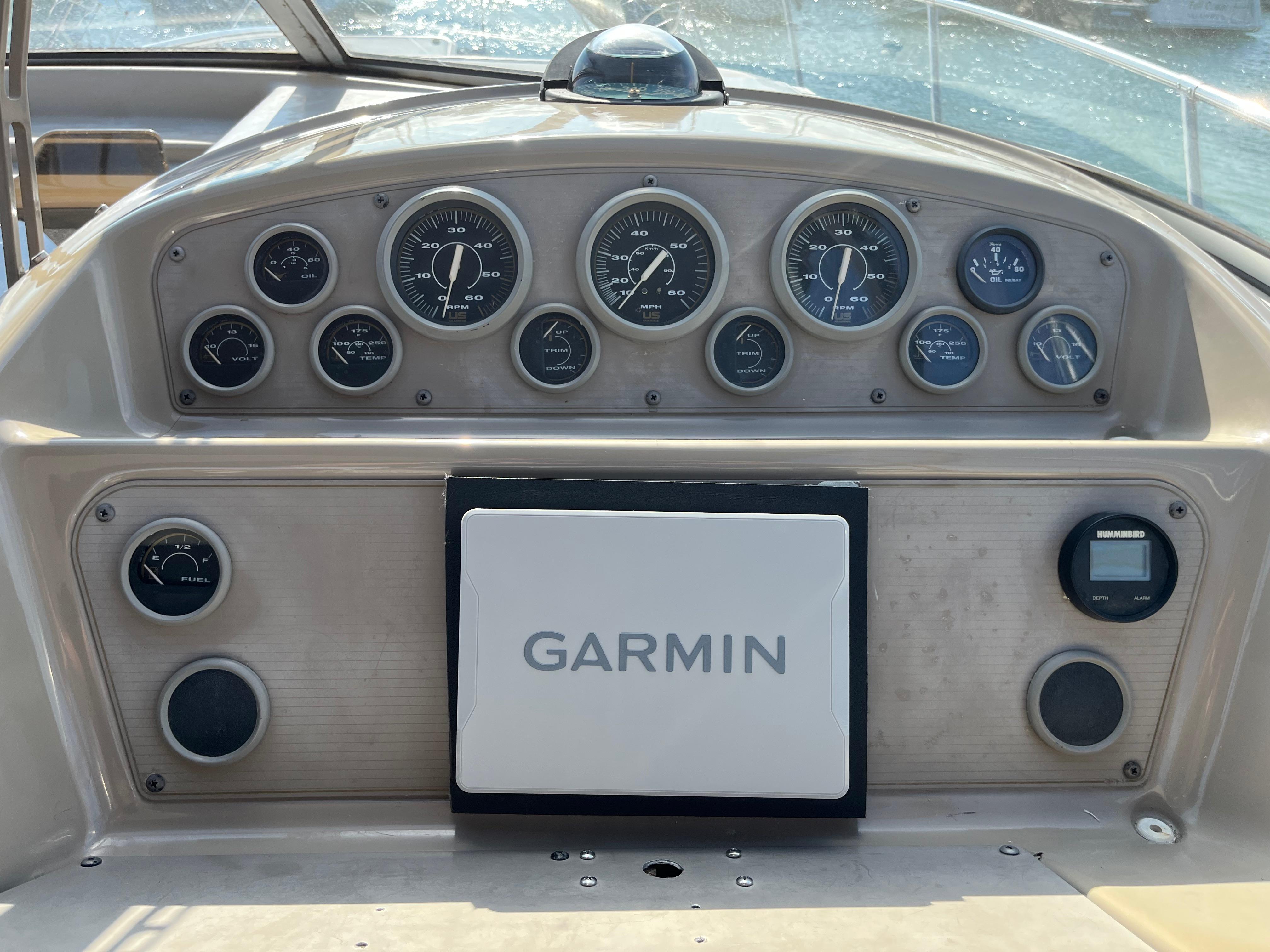 Slide: The Image of Dashboard of a 1996 Bayliner 32 Avante boat with Garmin navigation system. - 14