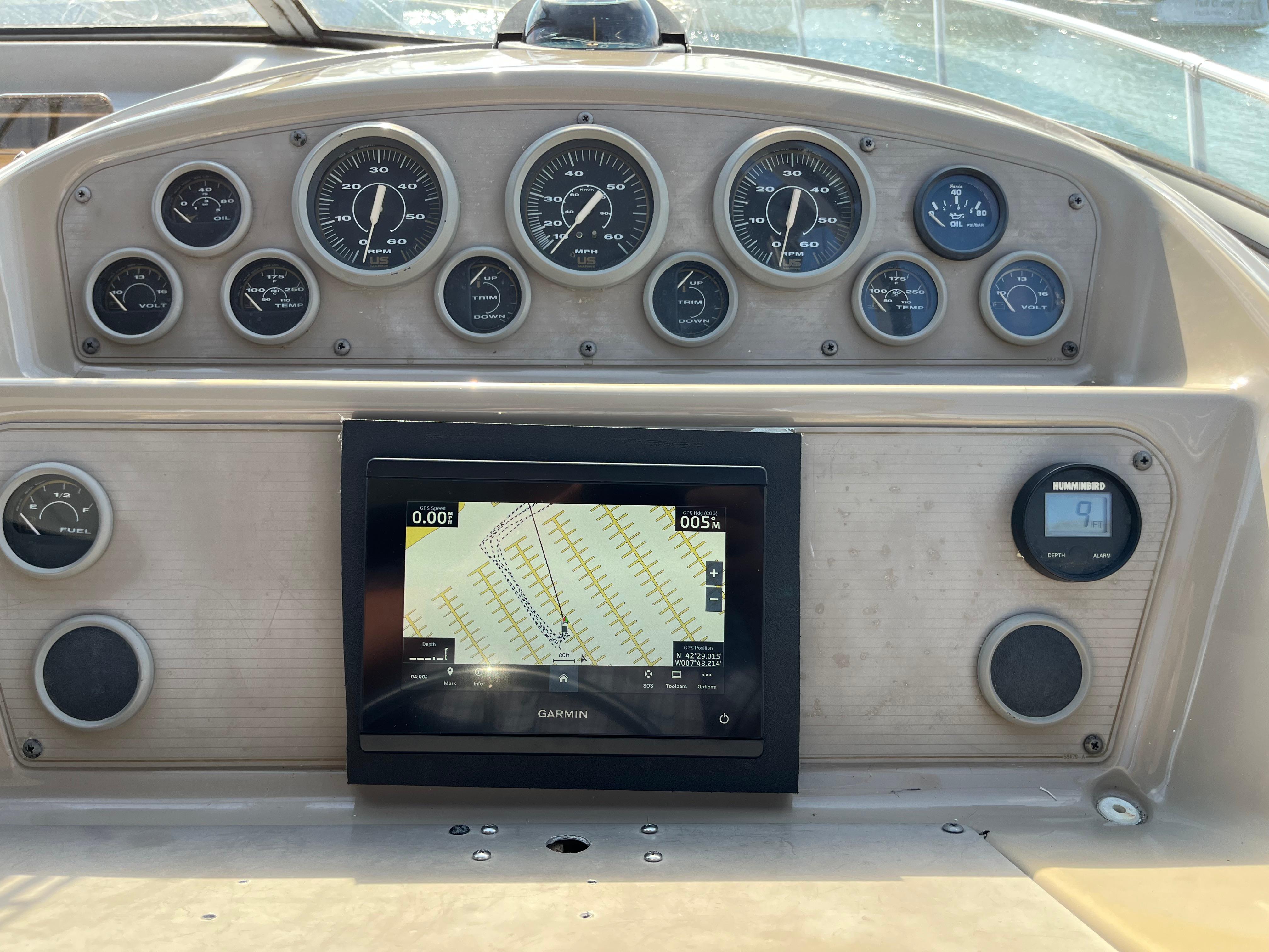 Slide: The Image of Dashboard of a 1996 Bayliner 32 Avante boat with Garmin navigation system. - 16
