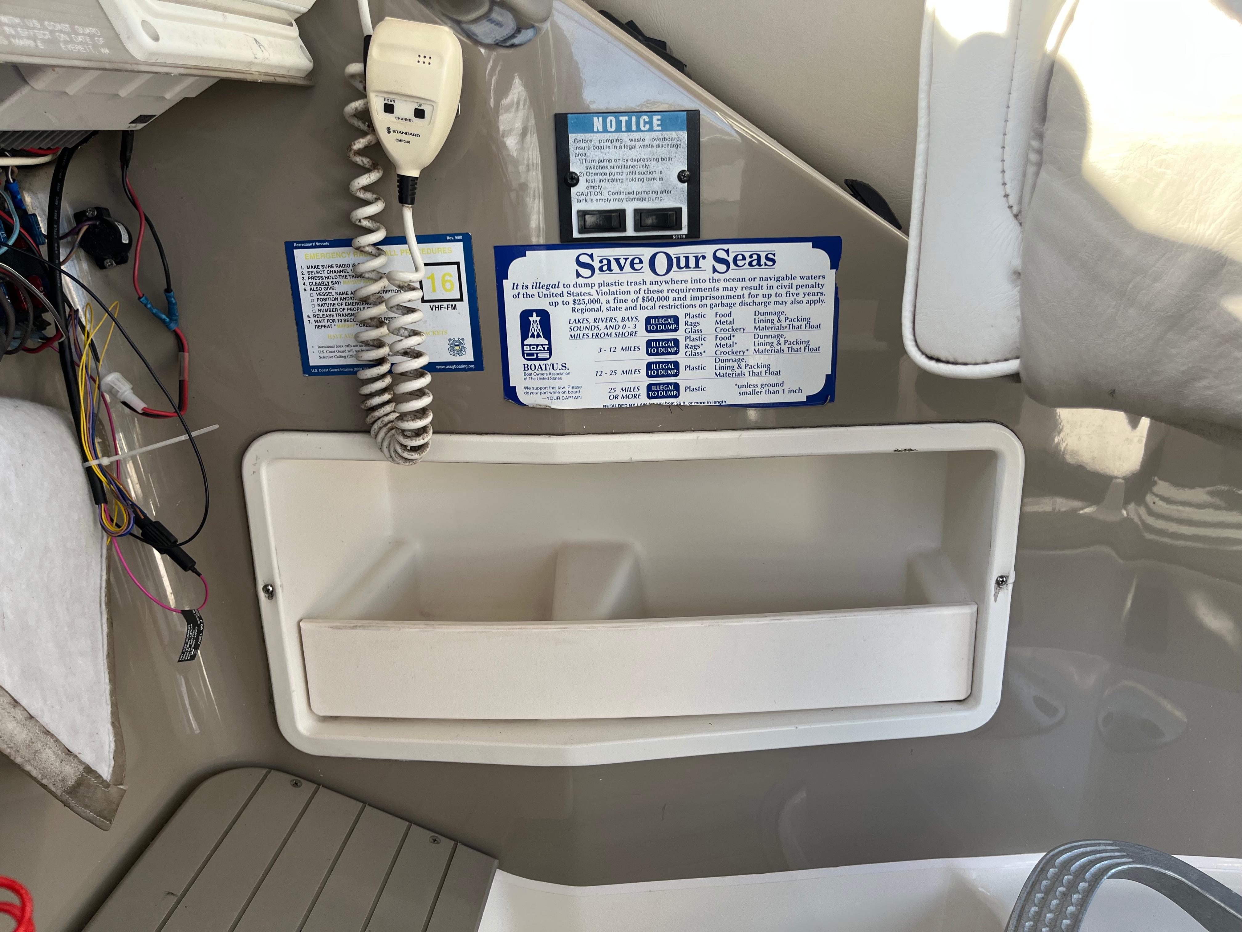 Slide: The Image of Control panel of a 1996 Bayliner 32 Avante boat with a Save Our Seas notice. - 5