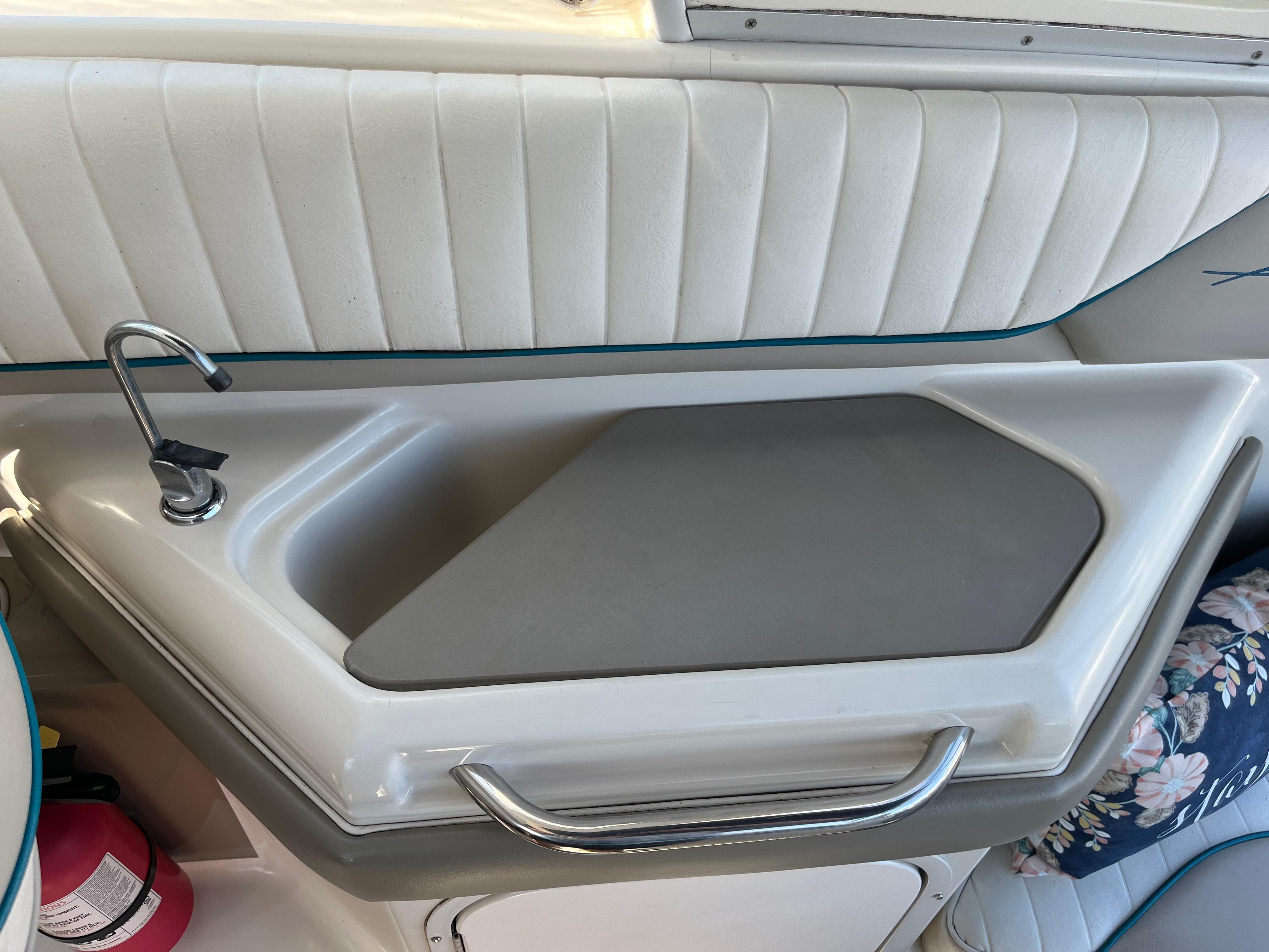 Slide: The Image of 1996 Bayliner 32 Avante boat interior sink and counter area. - 7
