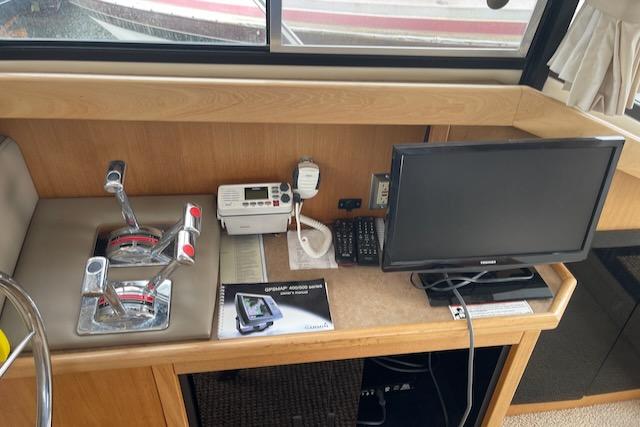 Slide: The Image of Control panel of a 2000 Bayliner 3388 boat with monitor and communication devices. - 17