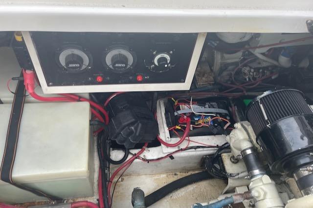 Slide: The Image of Engine compartment of a 2000 Bayliner 3388 boat showing gauges and wiring. - 23