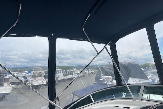 Slide: The Image of View from the cockpit of a 2000 Bayliner 3388 yacht in a marina. - 34