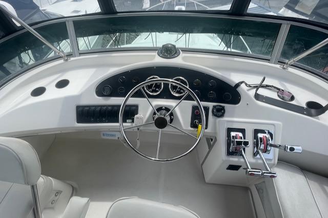 Slide: The Image of Helm of 2000 Bayliner 3388 boat with steering wheel and control panel. - 4
