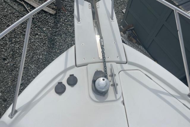 Slide: The Image of Bow of a 2000 Bayliner 3388 boat with anchor chain and fittings. - 40
