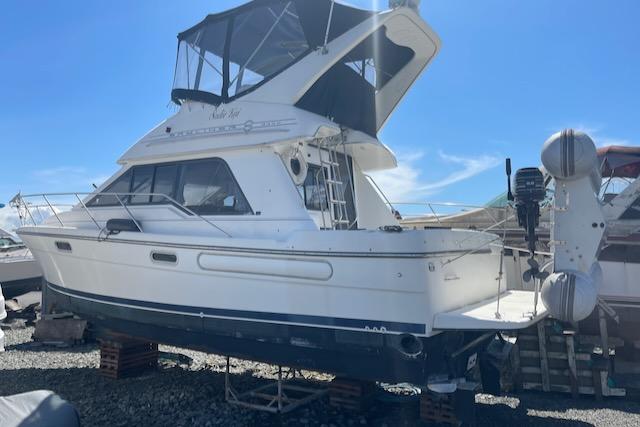 Slide: The Image of 2000 Bayliner 3388 motor yacht on dry dock. - 42