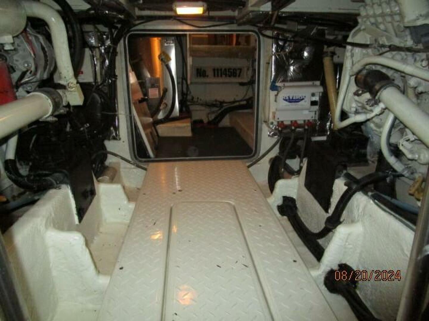 Slide: The Image of 47' Bayliner engine room forward - 4609463