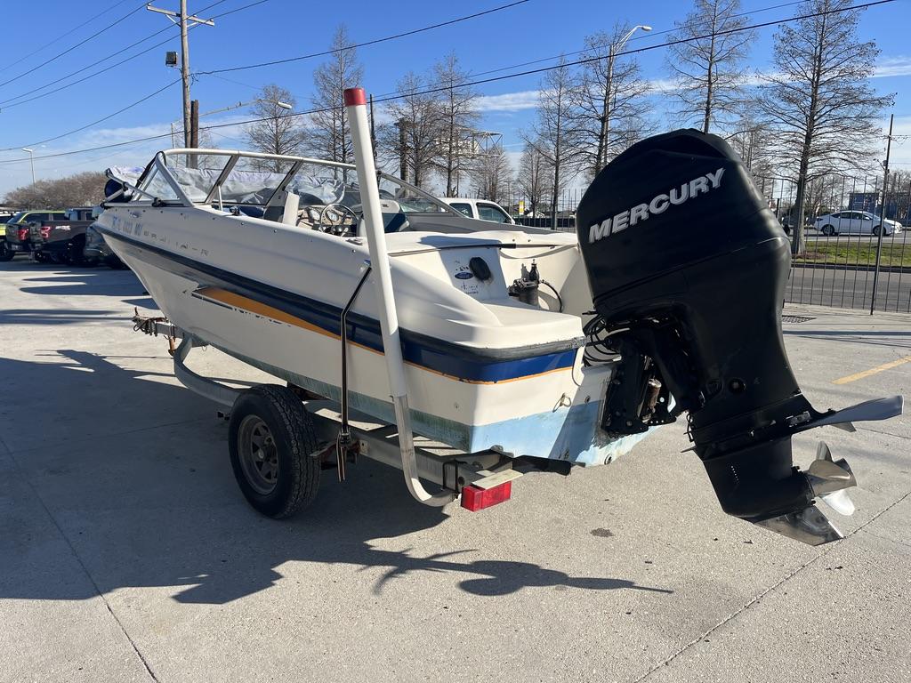Slide: The Image of 2004 Bayliner 175 boat with Mercury outboard motor on trailer. - 10