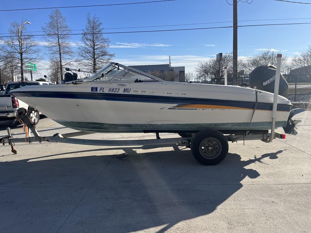 Slide: The Image of 2004 Bayliner 175 boat on trailer with Mercury outboard motor. - 11