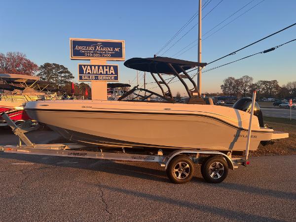 Slide: The Image of 2024 Bayliner DX2000 boat on trailer at Anglers Marine NC dealership. - 0
