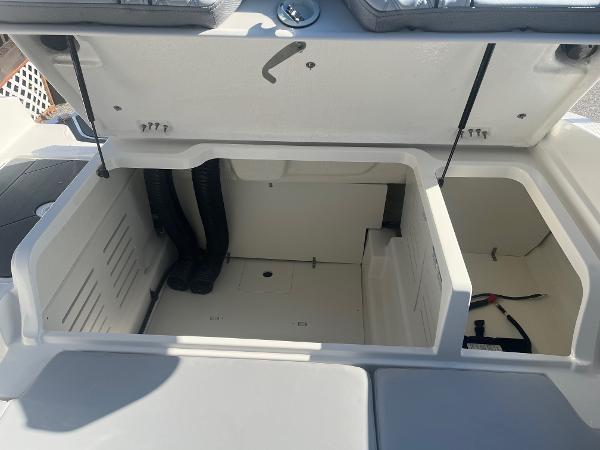 Slide: The Image of 2024 Bayliner DX2000 storage compartments with open hatch. - 12