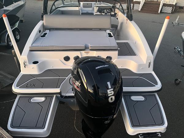 Slide: The Image of 2024 Bayliner DX2000 boat with Mercury 150 outboard motor, rear view. - 3