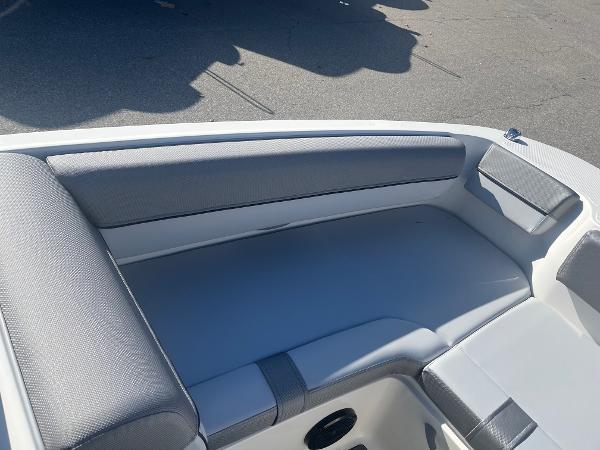 Slide: The Image of 2024 Bayliner DX2000 boat interior seating with gray upholstery. - 6