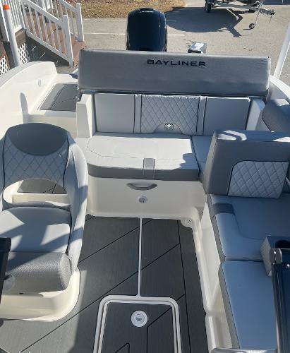 Slide: The Image of 2024 Bayliner DX2000 boat interior with gray and white seating. - 8