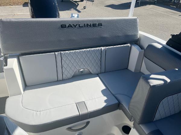 Slide: The Image of 2024 Bayliner DX2000 boat interior seating with gray upholstery. - 9