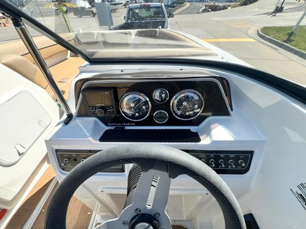 Slide: The Image of Dashboard of 2023 Bayliner DX 2050 boat with steering wheel and instrument panel. - 15