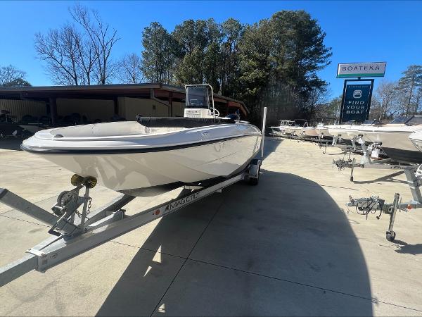 Slide: The Image of 2021 Bayliner E21 boat on a trailer at a dealership. - 0