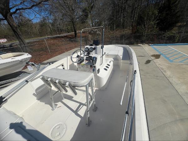 Slide: The Image of 2021 Bayliner E21 boat interior with steering console and seating. - 4