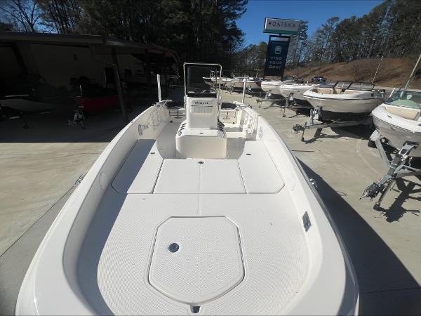 Slide: The Image of 2021 Bayliner E21 boat on display at a dealership. - 5