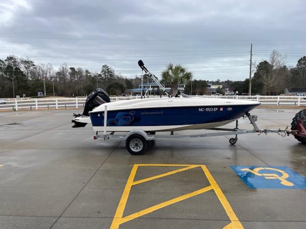 Slide: The Image of 2020 Bayliner Element E16 boat on trailer in parking lot. - 3