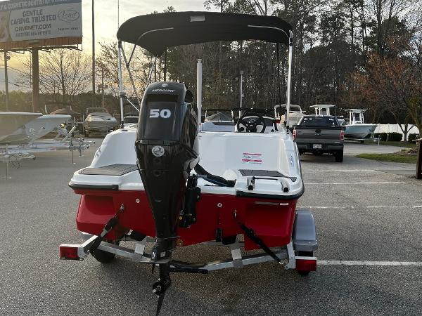 Slide: The Image of 2024 Bayliner Element M15 boat with Mercury 50 engine, parked on a trailer. - 3