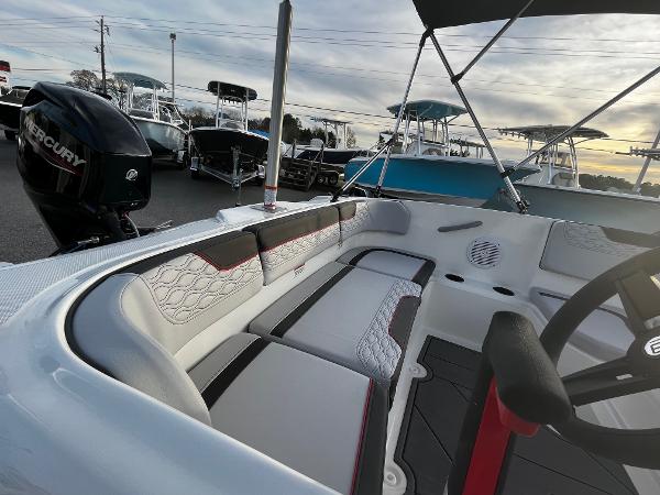 Slide: The Image of 2024 Bayliner Element M15 boat interior with seating and steering wheel. - 4