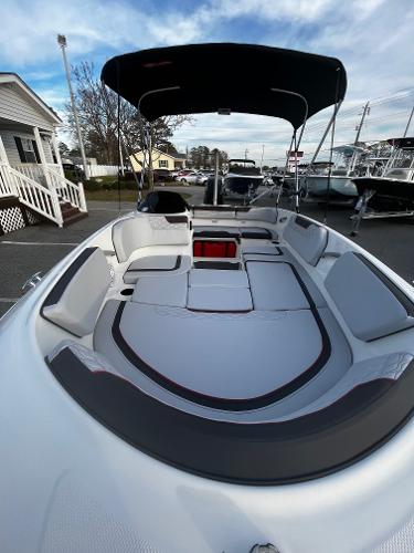 Slide: The Image of 2024 Bayliner Element M15 boat with spacious seating and canopy. - 6