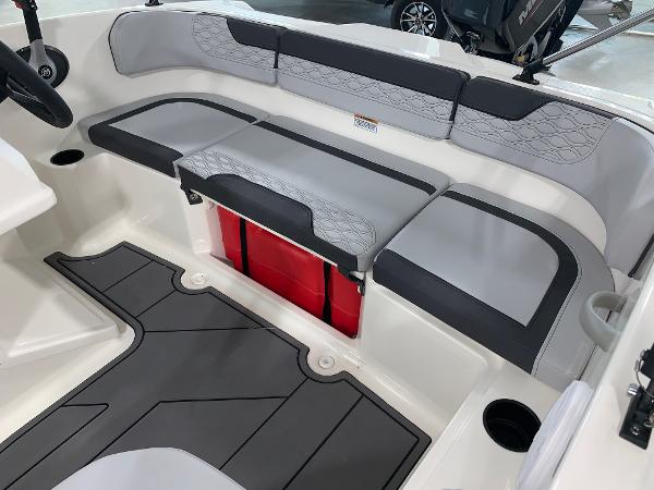 Slide: The Image of 2024 Bayliner Element M15 boat interior with gray and black seating. - 7
