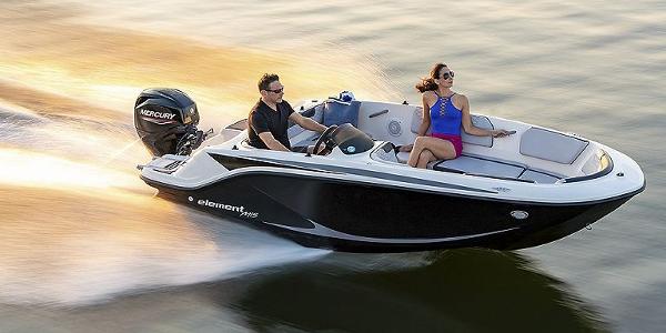 Slide: The Image of 2024 Bayliner Element M15 boat cruising on water at sunset. - 8