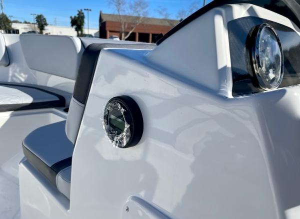 Slide: The Image of 2024 Bayliner Element M15 boat interior with seating and dashboard. - 9