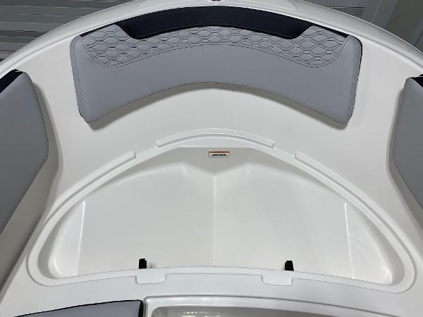 Slide: The Image of 2024 Bayliner Element M15 boat interior with cushioned seating and storage compartments. - 9