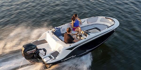 Slide: The Image of 2024 Bayliner Element M15 boat cruising on water with two passengers. - 9
