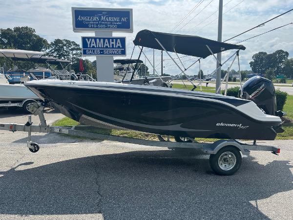 Slide: The Image of 2024 Bayliner Element M17 boat on trailer at Angler's Marine dealership. - 0