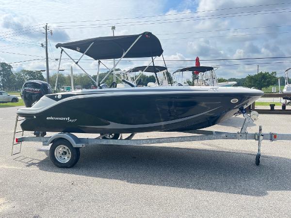 Slide: The Image of 2024 Bayliner Element M17 boat on trailer with canopy. - 1