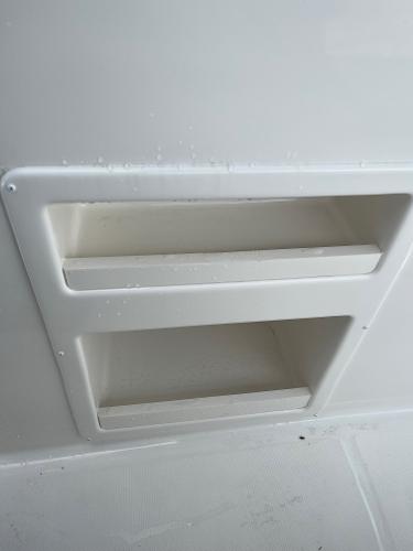 Slide: The Image of Built-in storage compartments on the 2024 Bayliner Element M17 boat. - 11