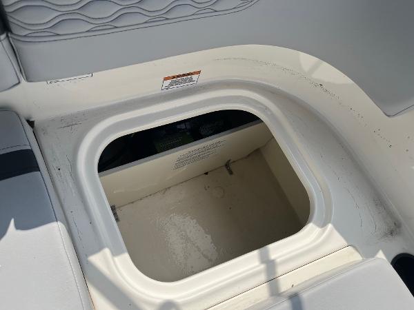 Slide: The Image of 2024 Bayliner Element M17 storage compartment with open hatch. - 12